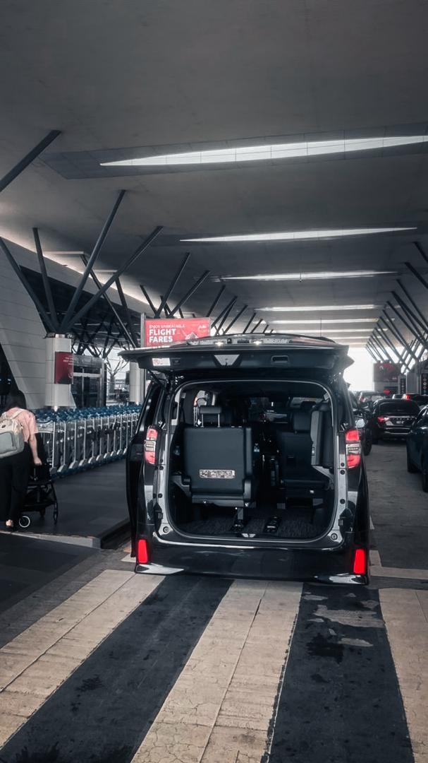 Ellrae luxury MPV positioned at the airport pickup zone
