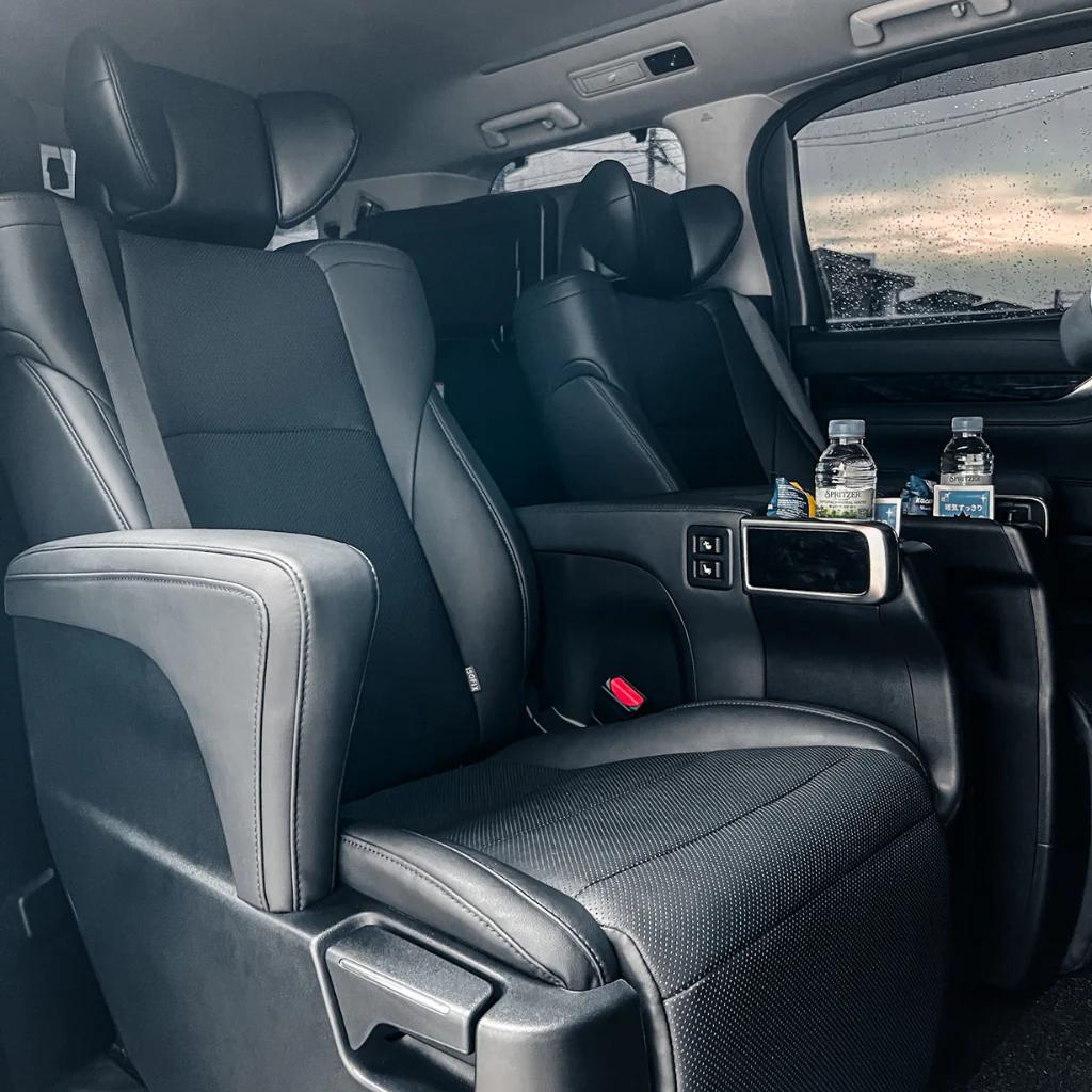 Toyota Vellfire captain seat cabin prepared with bottled water