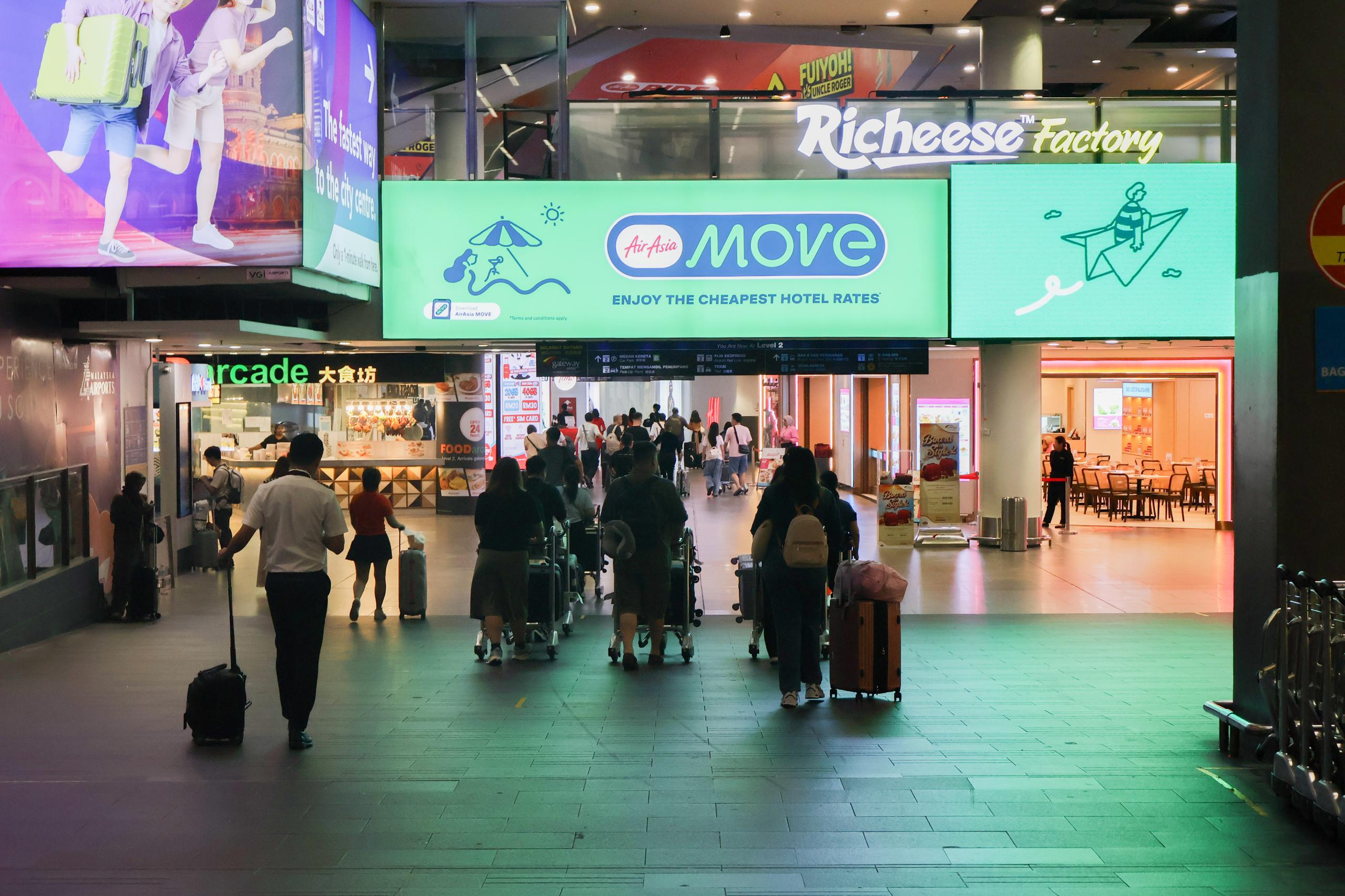 KLIA Terminal 2 walkway after arrival hall with food arcade ahead